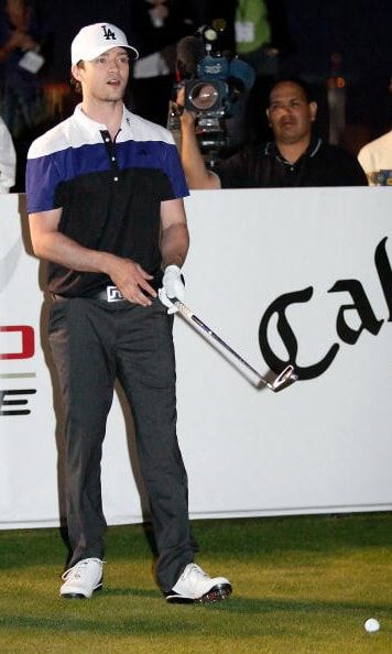 Off the stage and on the green, JT showed off his golf skills and putting fashion during a charity golf event in October 2009.
<br>
Photo: Getty Images
