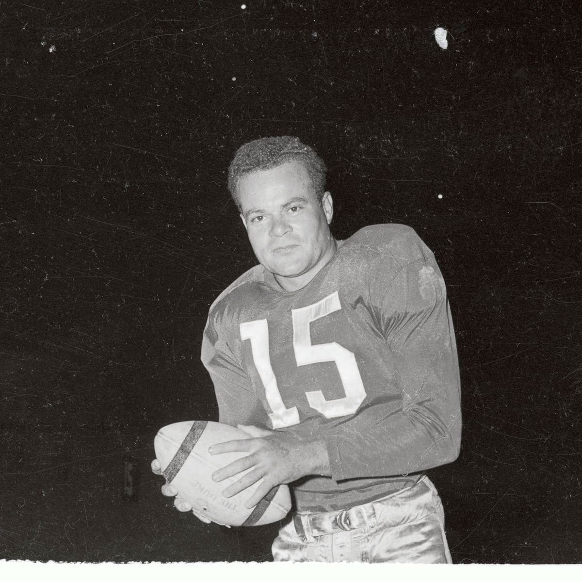 Steve Van Buren in Uniform and Holding Football