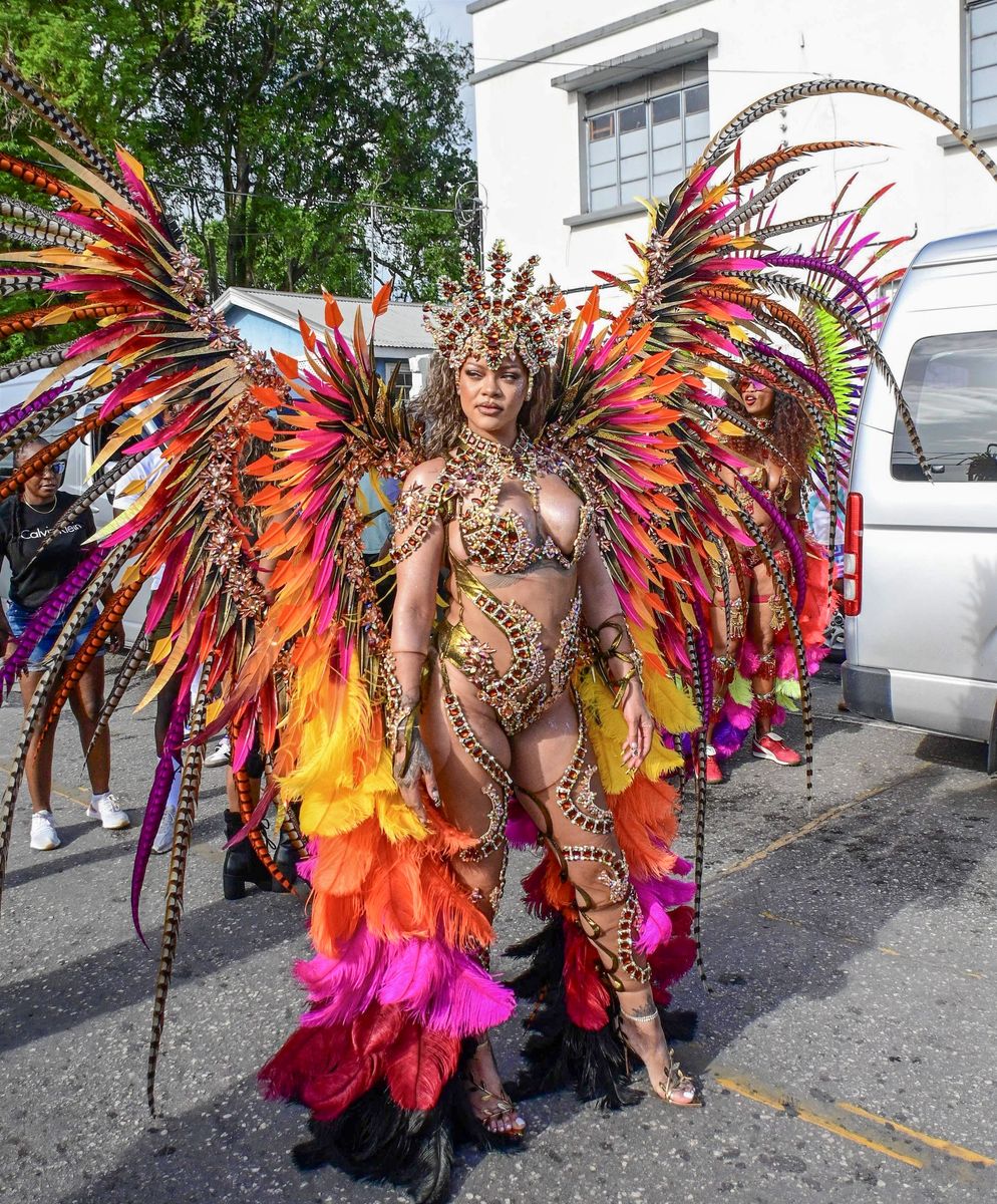 
Singer Rihanna Stuns at Carnival Festival In Barbados As She Poses With Police Officers In Her 2024 Outfit Consisting of Bewejeled Bra Head- To-Toe.