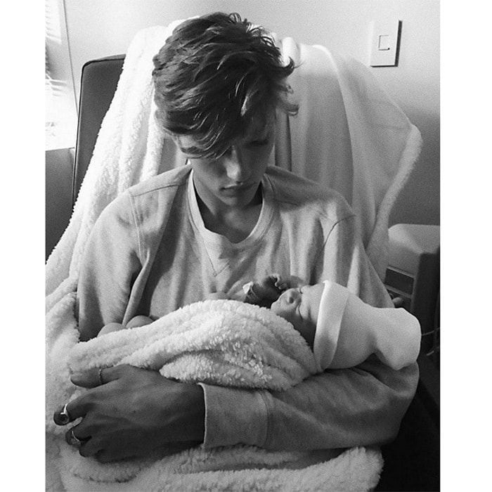 <b>Lucky Blue Smith</B>
Model Lucky Blue Smith, 19, is a dad! The fashion star, who announced girlfriend Stormi Bree's pregnancy in March, shared this sweet photo of himself holding his newborn daughter, Gravity.
He captioned the photo: "She's here meet Gravity Blue Smith, I've never felt so happy... I love you more than anything in this whole world little princess."
Photo: Instagram/@luckybluesmith