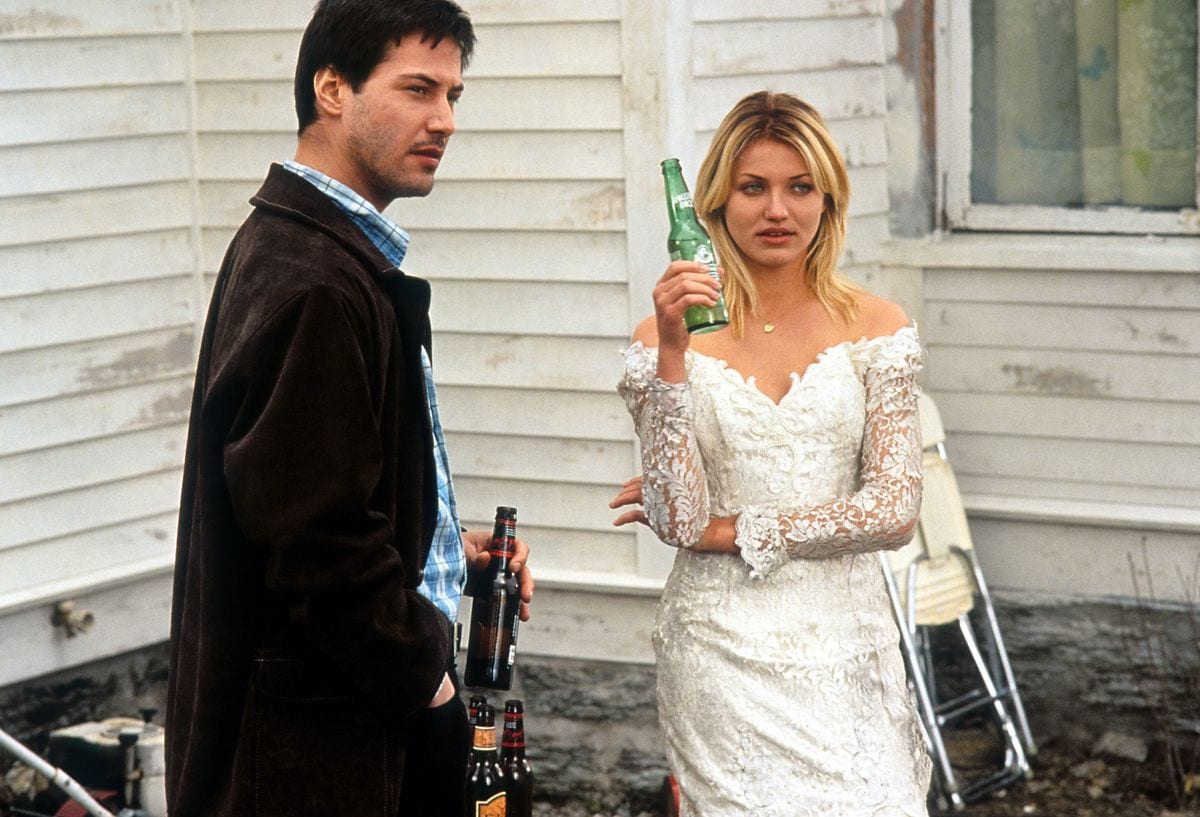 Keanu Reeves and Cameron Diaz having beers in a scene from the film 'Feeling Minnesota', 1996.