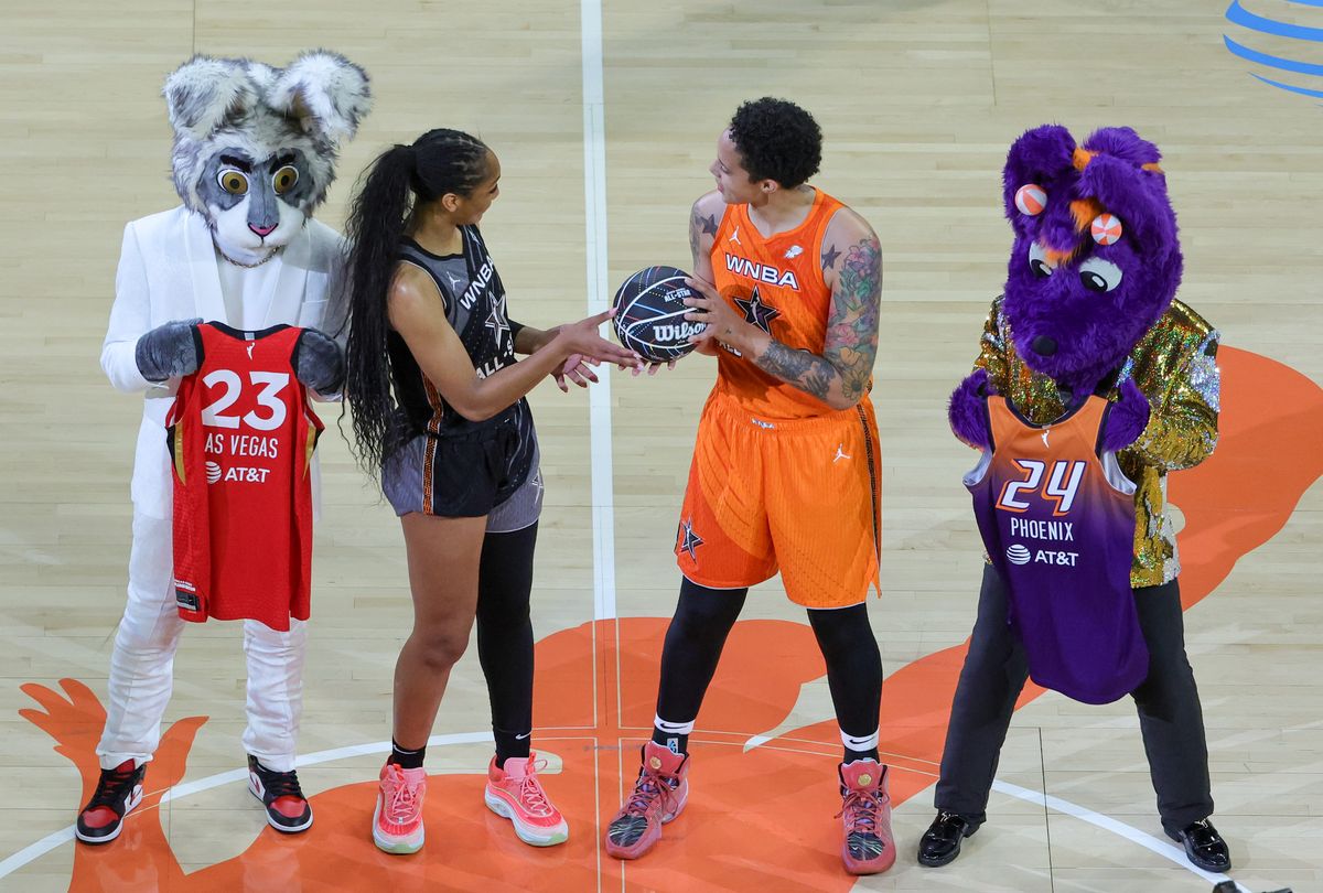 A'ja Wilson (2nd L) #22 of Team Wilson hands a basketball to Brittney Griner #42 of Team Stewart as Las Vegas Aces mascot BUCKET$ (L) and Phoenix Mercury mascot Scorch look as it is announced that the Mercury will host the 2024 WNBA All-Star Game during the second half of the 2023 WNBA All-Star Game at Michelob ULTRA Arena on July 15, 2023 in Las Vegas, Nevada. 