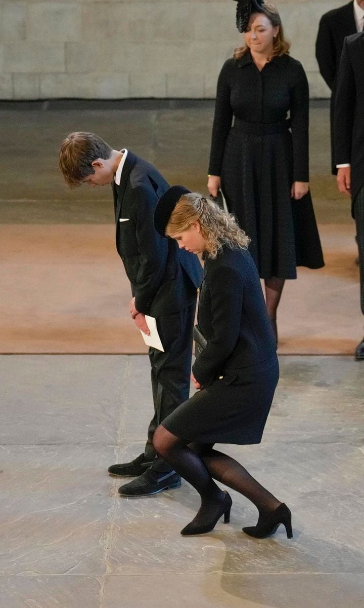 Her Majesty's youngest grandson and granddaughter paid their respects, bowing and curtsying.