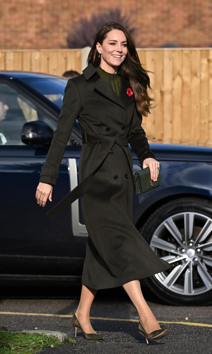 The Princess bundled up in a chic olive Hobbs London coat on Nov. 9.