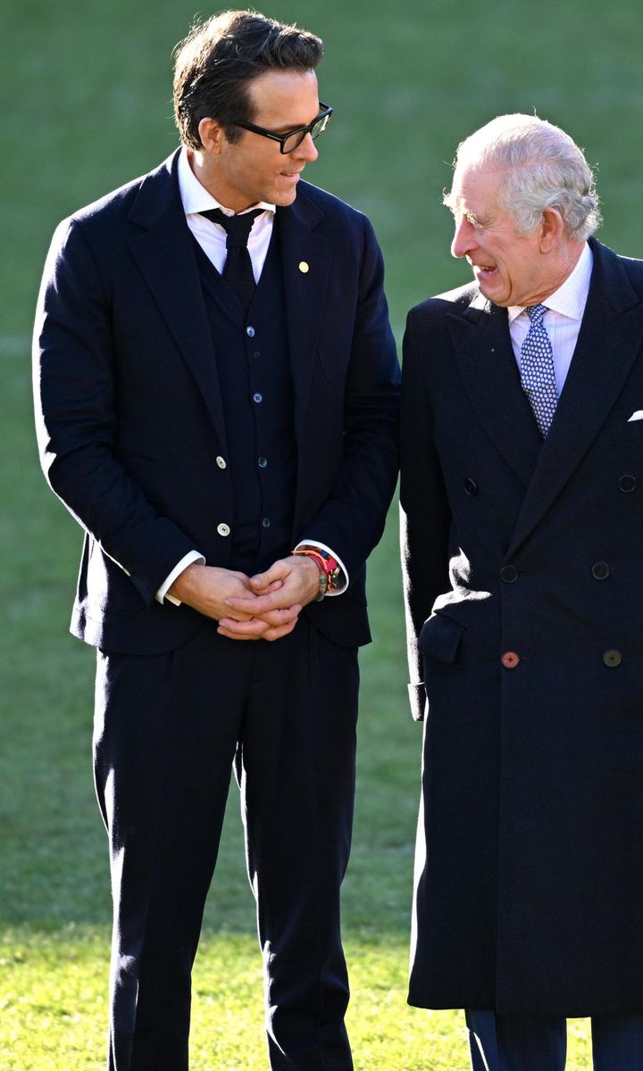 The actor appeared to make the King laugh during the visit.