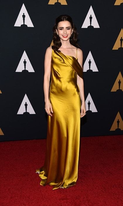 Actress <a href="https://us.hellomagazine.com/tags/1/lily-collins/"><strong>Lily Collins</strong></a> wore a gorgeous mustard satin dress by Amanda Wakeley for the Academy of Motion Picture Arts and Sciences' 8th Annual Governors Awards at The Ray Dolby Ballroom at Hollywood & Highland Center.
Photo: Getty Images