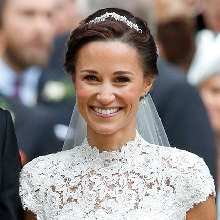 <B>WEAR A MINI-TIARA</B>
Every bride is a princess on her wedding day! Instead of opting for a large tiara, Pippa picked a discreet Robinson Pelhamdiamond and white gold headpiece that looked exquisite with her tulle Stephen Jones veil. Her tiara is so understated but glamorous that it would suit every bride.
Photo: Getty Images