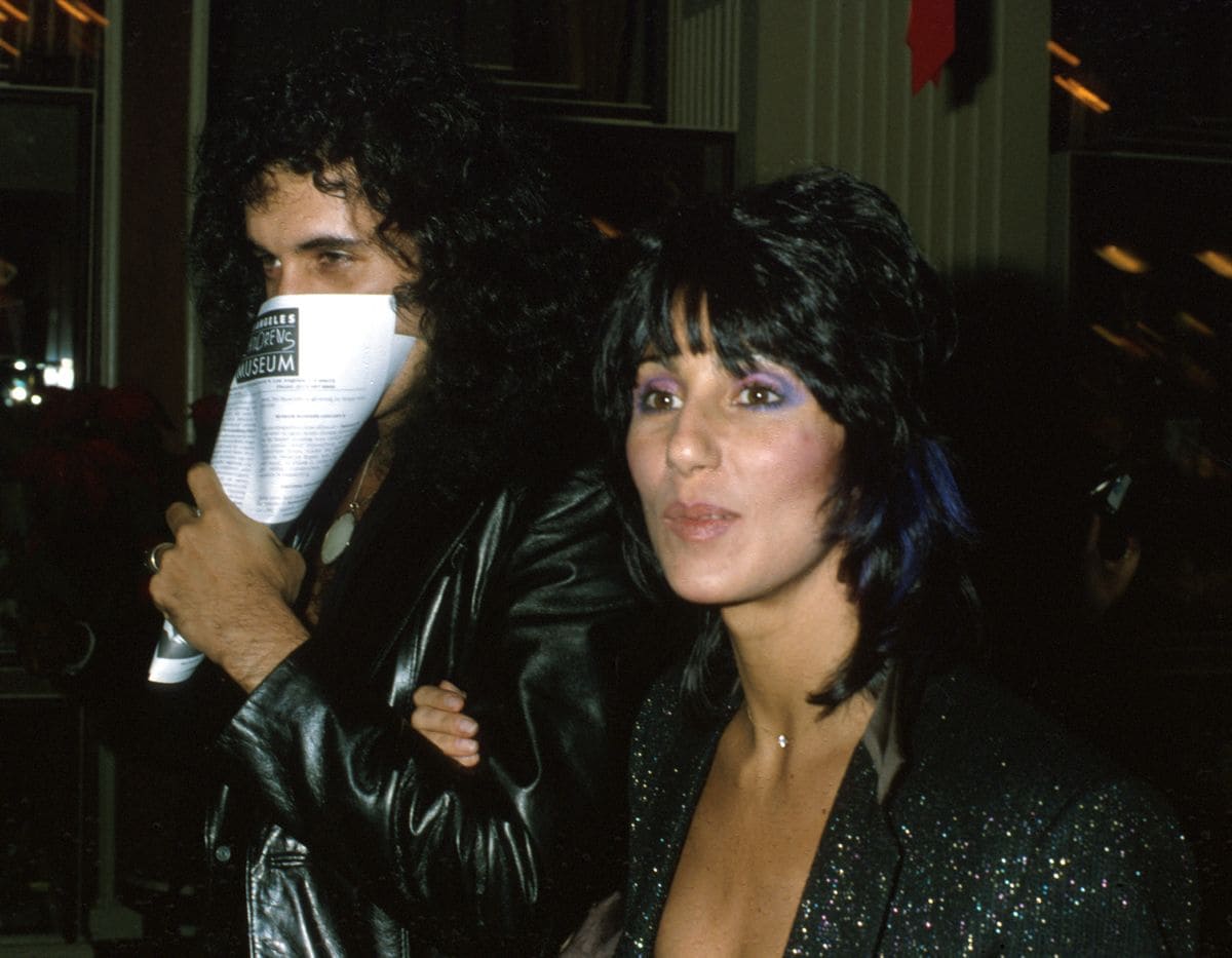 DECEMBER 1979: Entertainers and celebrity couple Gene Simmons and Cher attend the premiere of the movie "Kramer vs. Kramer" in December 1979. (Photo by Michael Ochs Archives/Getty Images) 