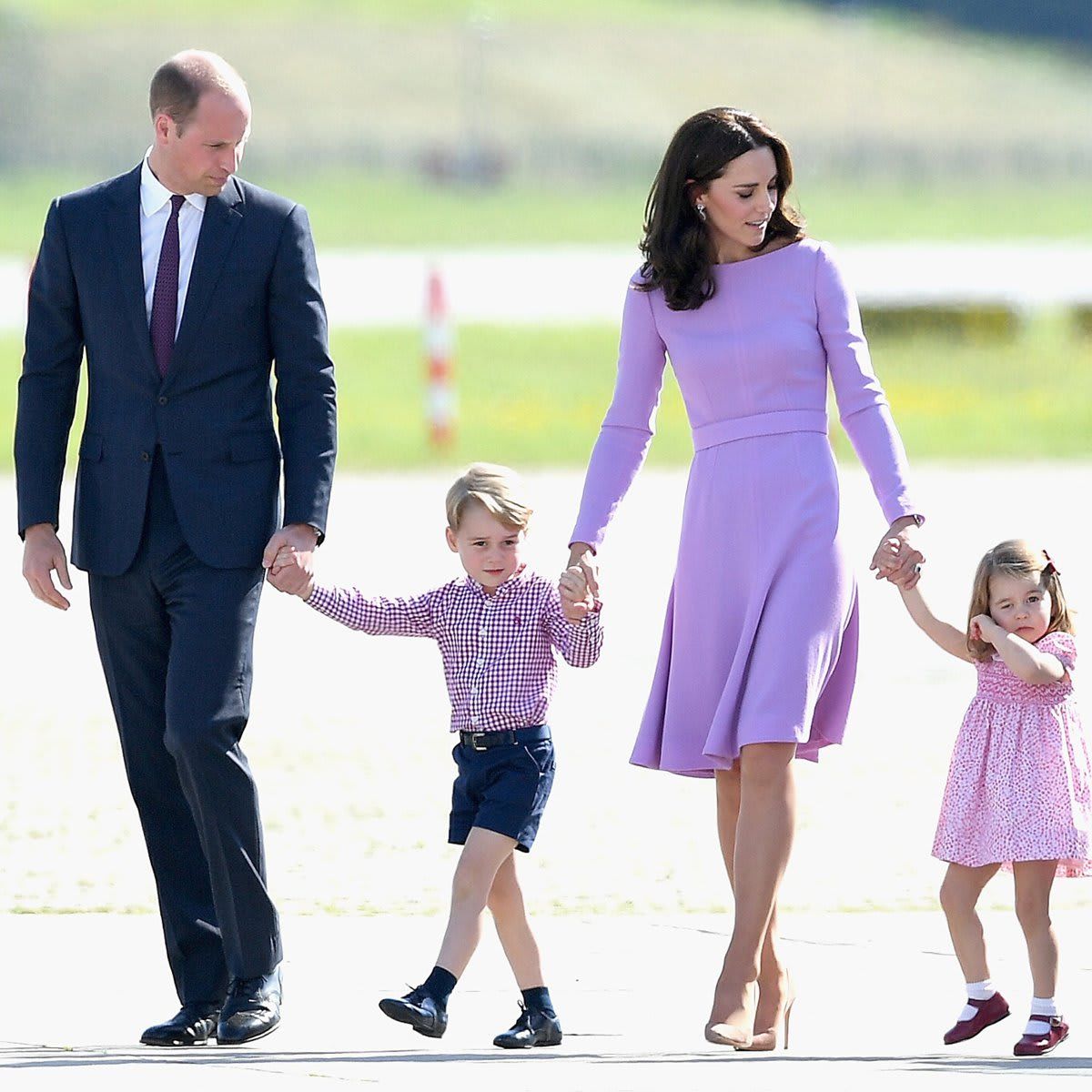 William and Kate kept an eye on their son and daughter while viewing helicopter models during their 2017 visit to Hamburg, Germany.