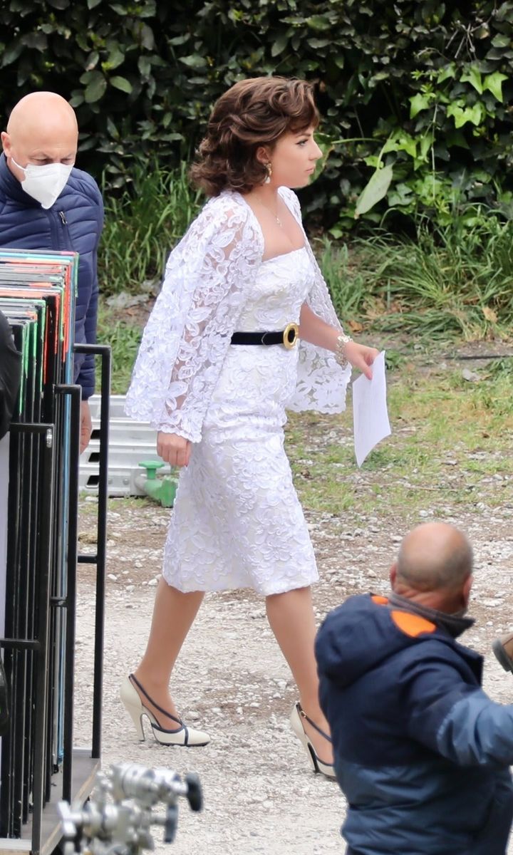 Lady Gaga Looks Gorgeous in a White Lace Midi Dress on the Set of House Of Gucci