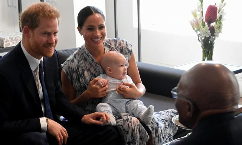 Meghan Markle holds baby Archie on knees