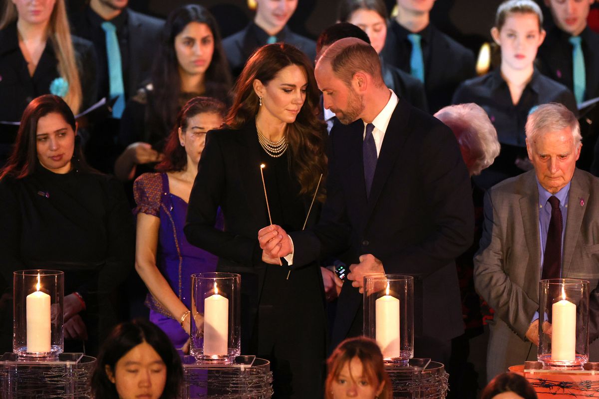 LONDON, ENGLAND - JANUARY 27: Catherine, Princess of Wales and Prince William, Prince of Wales light candles during a ceremony commemorating Holocaust Memorial Day on January 27, 2025 in London, England. Prime Minister Keir Starmer and Prince William were among the British officials and celebrities who marked Holocaust Memorial Day and the 80th anniversary of the liberation of Auschwitz-Birkenau during World War II. (Photo by Dan Kitwood/Getty Images)