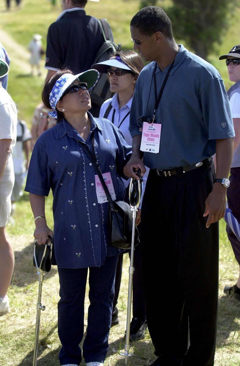 NEW ZEALAND - JANUARY 10:  Kutilda Woods, mother of World No1 golfer Tiger Woods walks the course to watch her son with Nike representative Greg Nared during the first round of the Telstra Hyundai New Zealand Open 2002 golf tournament at the Paraparaumu Beach Golf Club north of Wellington, today, Thursday.  (Photo by Ross Land/Getty Images)