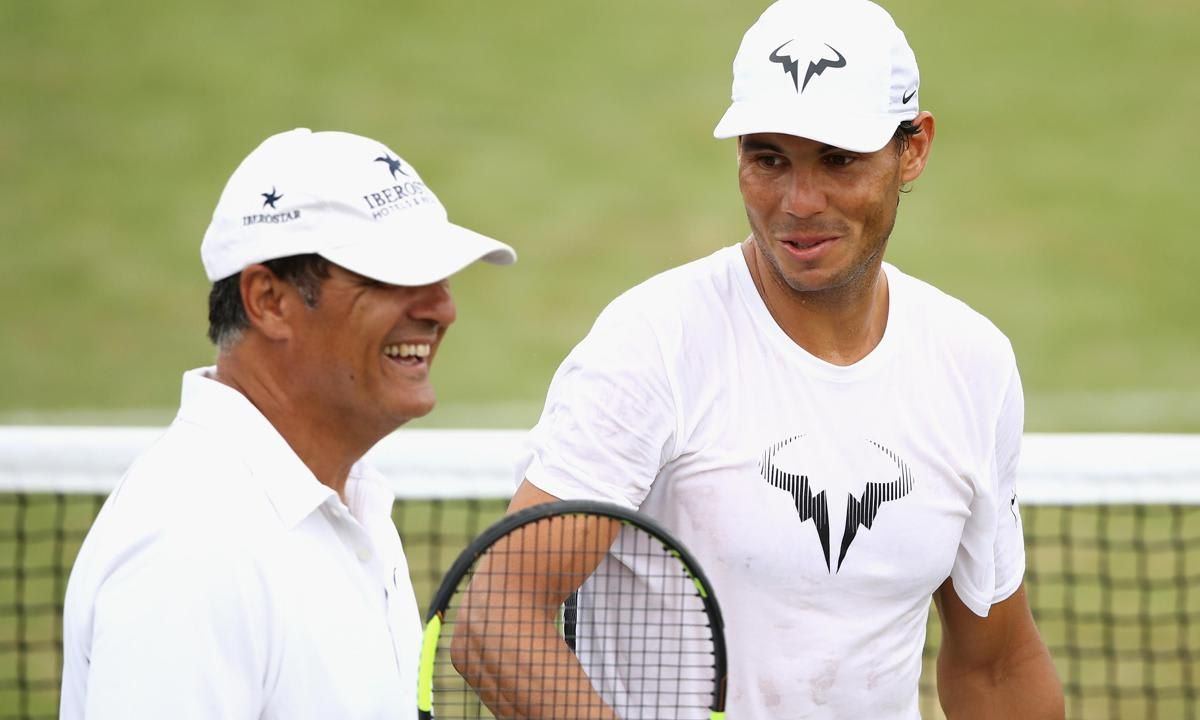 A photo of Rafael Nadal in a training session with coach and uncle Toni Nadal at Wimbledon 2017.