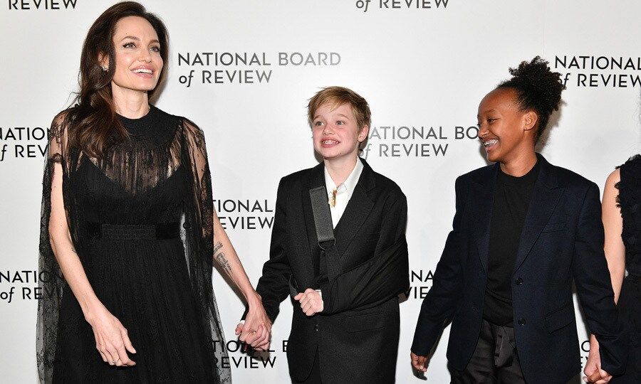 Angelina Jolie brought daughters Shiloh and Zahara to the National Board of Review. While all three dressed in black, her 11-year-old daughter sported an extra accessory a cast after she fell during a winter vacation in Lake Tahoe, California over the holidays.
Photo: Getty Images