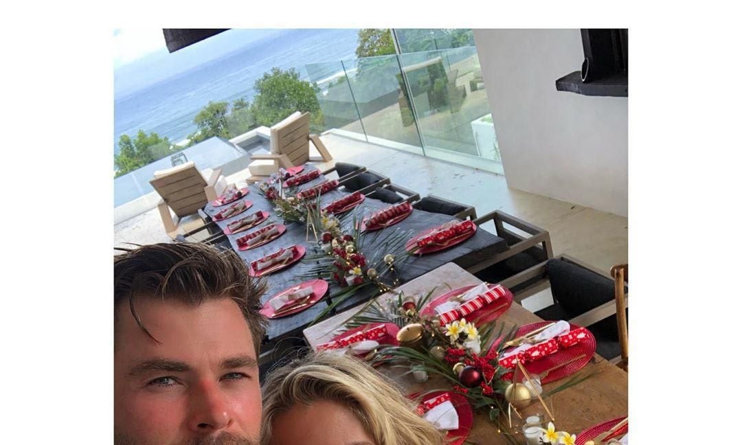 Chris Hemsworth and Elsa Pataky posing in their new home waiting for Christmas guests