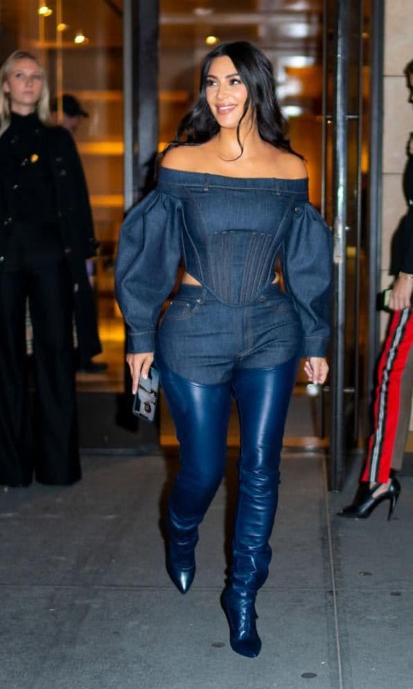 Kim Kardashian in an all-denim look with thigh-high boots