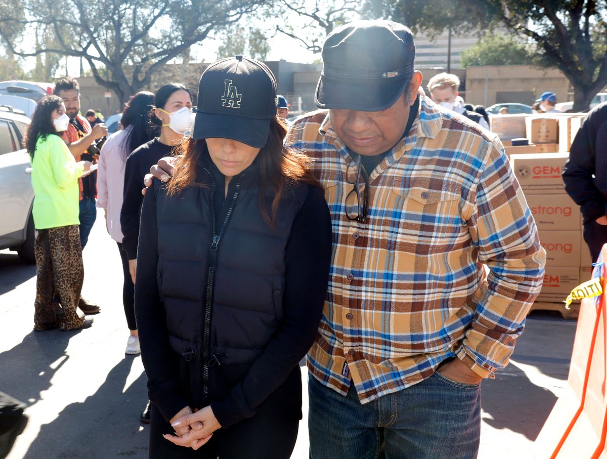 Longoria and a volunteer surveying the area