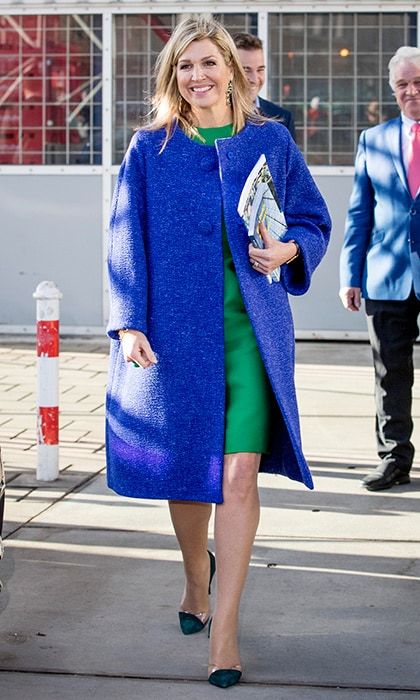 Queen Maxima of the Netherlands had a bright smile as she visited family company Octatube on Entrepreneur's Day on November 17 in Delft. Also bright was the Dutch royal's color block outfit: a green silk dress and blue jacket with transparent cap toe pumps.
Photo: Patrick van Katwijk/Getty Images