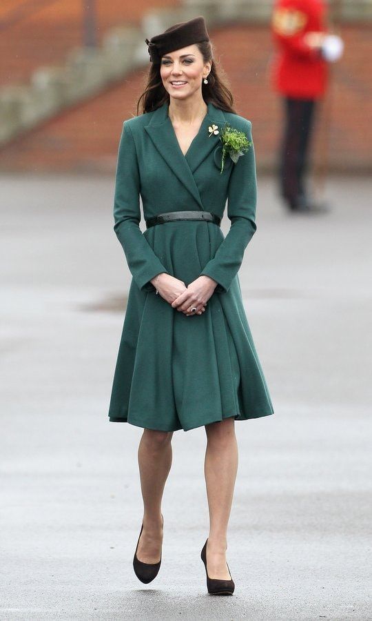 <b>2012</B>
In 2012, the Duchess of Cambridge chose her favorite cinched-waist fit-and-flare silhouette and a dark brown pillbox hat to visit the Irish Guards in Aldershot, England.
Outfit details: Emilia Wickstead coat, Kiki McDonough earrings, Lock & Company hat and shoes by Emmy.
Photo: Chris Jackson/Getty Images