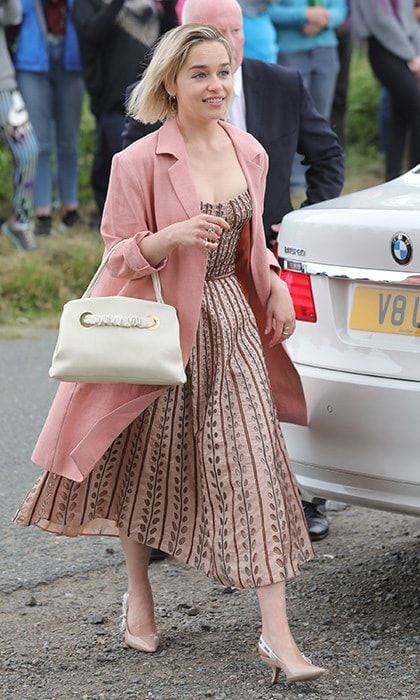 And then there were the guests! <I>GOT</I> co-star Emilia Clarke was pretty in pink, wearing a dusty rose 1950s-style midi dress, summer jacket and Dior heels.
Photo: Getty Images