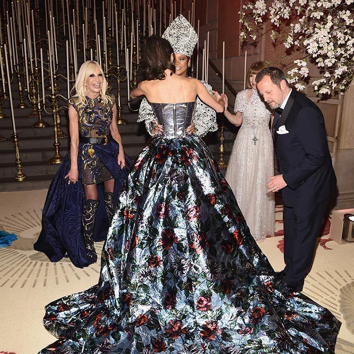 With their dramatic outfits, guests at the Met Ball have to carefully navigate the stairs and also the hugs! Amal Clooney gave Rihanna a careful embrace as two very amused onlookers Donatella Versace and Anna Wintour looked on.
Photo: Dimitrios Kambouris/MG18/Getty Images for The Met Museum/Vogue