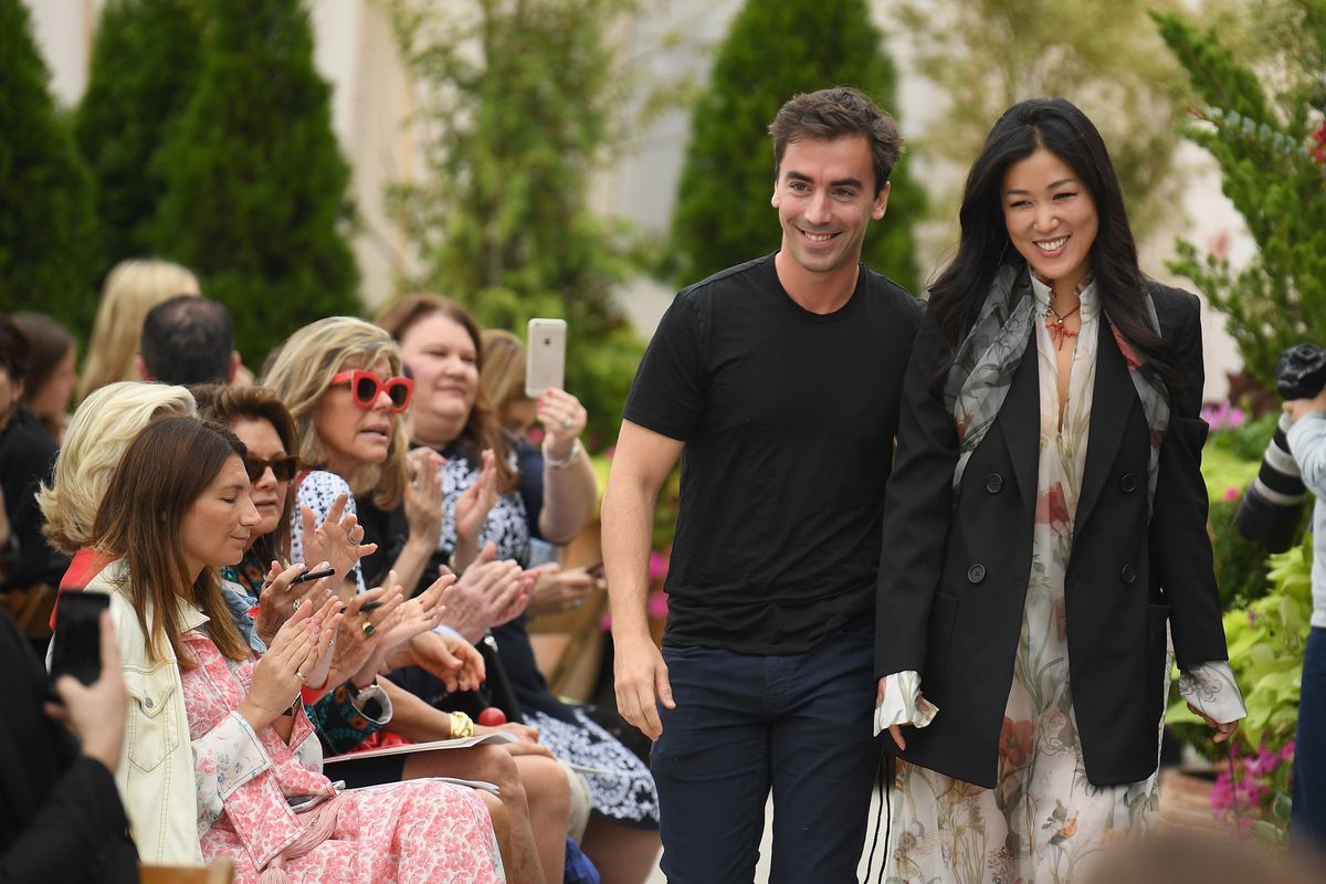  Oscar De La Renta creative directors Fernando Garcia (L) and Laura Kim greet the audience at the Oscar De La Renta front Row during New York Fashion Week: The Shows at Spring Studios Terrace on September 11, 2018 in New York City.  (Photo by Dimitrios Kambouris/Getty Images for NYFW: The Shows)