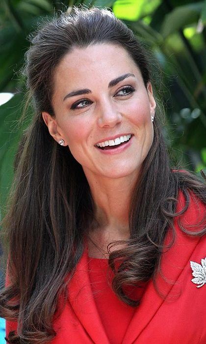 Adding some playfulness to one of her fave styles, Kate curled the ends of her half updo for a visit to Calgary Zoo.
<br>
Photo: Getty Images