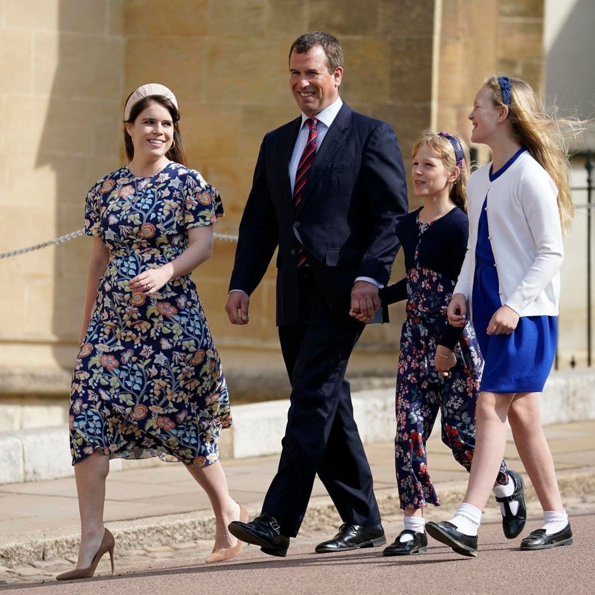 Isla Phillips held her dad Peter's hand while strolling next to big sister Savannah Phillips. The trio was joined by Peter's cousin Princess Eugenie as they made their way to St. George's Chapel.