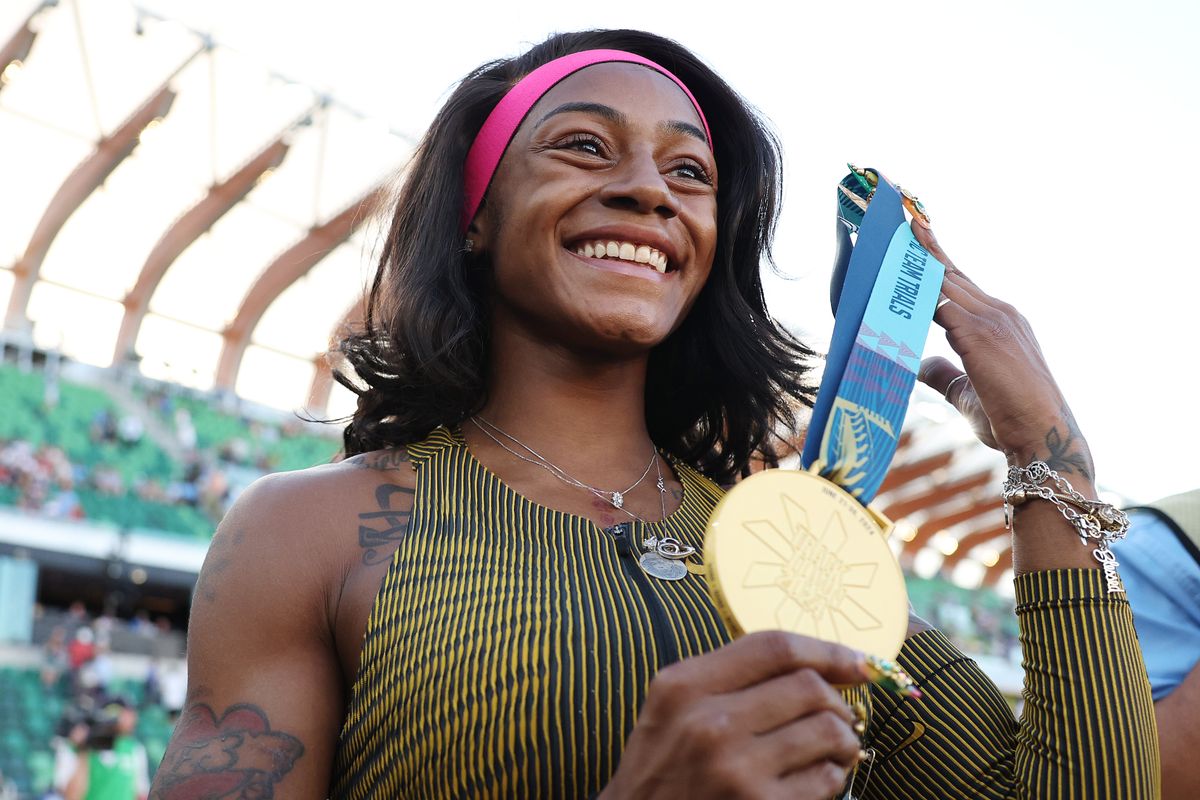 Sha'Carri Richardson poses with her gold medal after winning the women's 100-meter final on Day Two of the 2024 U.S. Olympic Team Track & Field Trials at Hayward Field on June 22, 2024, in Eugene, Oregon. 