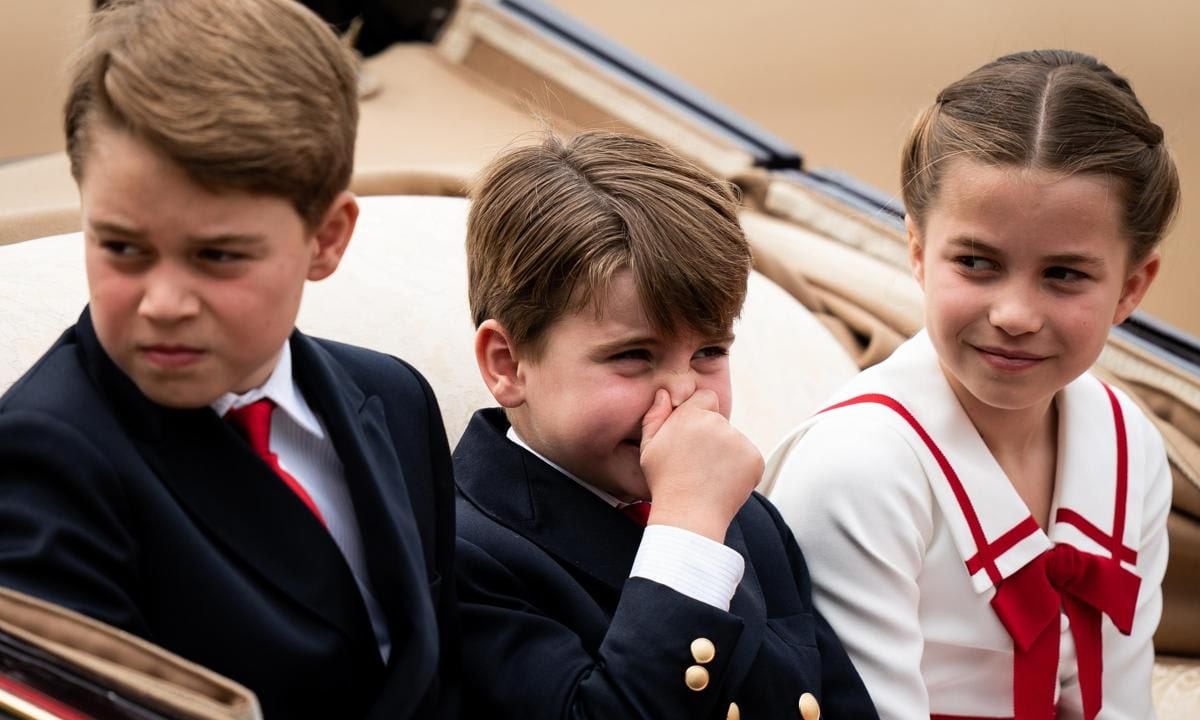 Louis was spotted at one point holding his nose, while big sister Charlotte looked on.