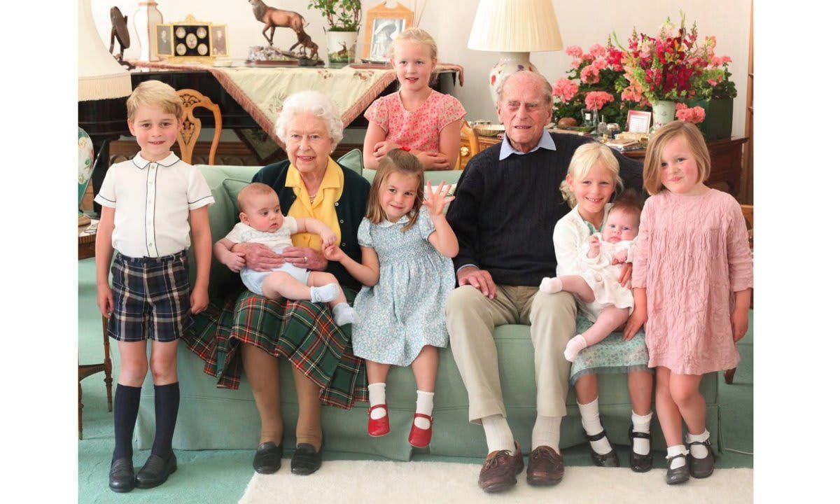 The photo of Queen Elizabeth and Prince Philip surrounded by seven of their great grandchildren was taken in 2018