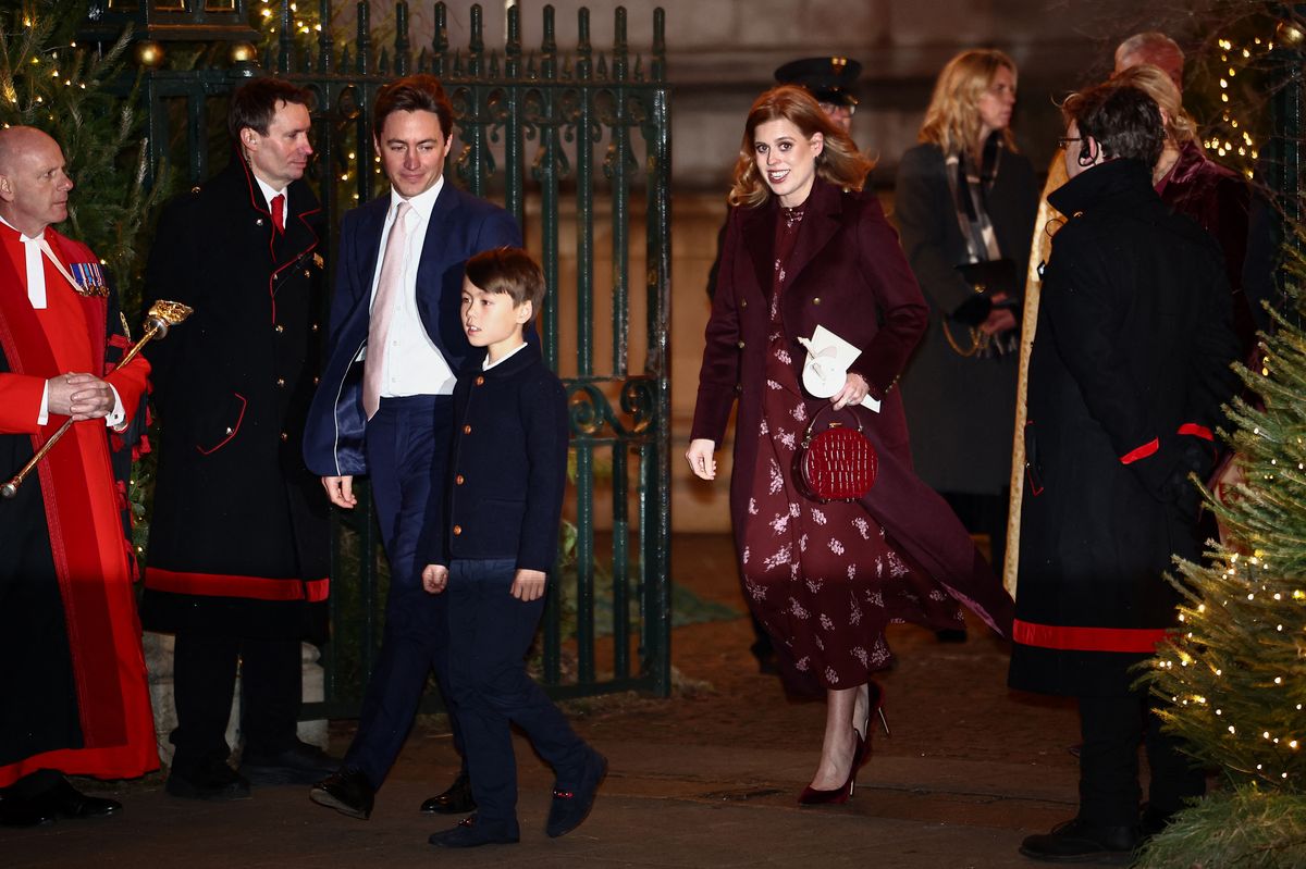 Britain's Princess Beatrice of York, her husband Edoardo Mapelli Mozzi and stepson Christopher leave following the "Together At Christmas" Carol Service" at Westminster Abbey in London on December 6, 2024. Britain's Catherine, Princess of Wales is organizing her traditional Christmas carol concert at Westminster Abbey on Friday evening, closing a painful year marked by her cancer, during which she will pay tribute to all those "who have gone through difficult times". (Photo by HENRY NICHOLLS / AFP) (Photo by HENRY NICHOLLS/AFP via Getty Images)