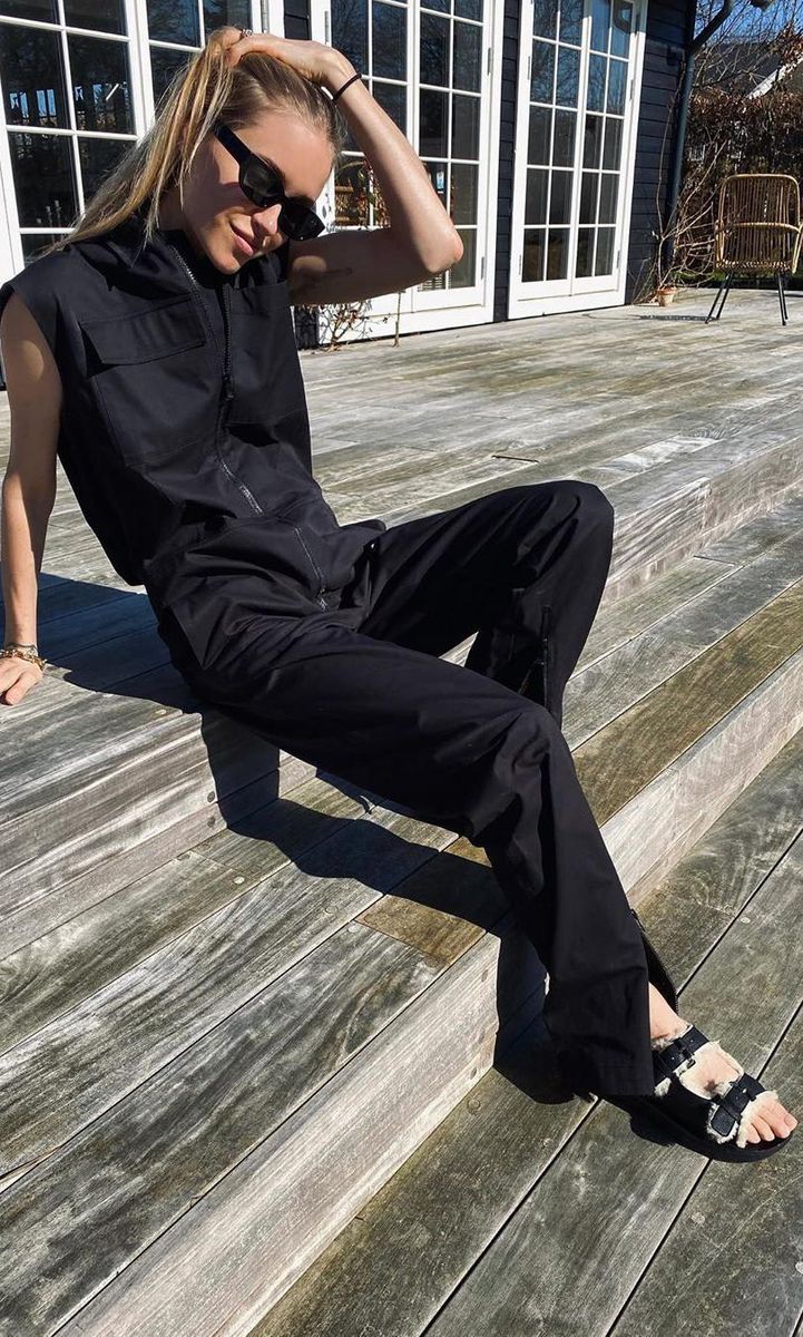 Pernille Teisbaek wearing fur-lined dad sandals in black with a jumpsuit