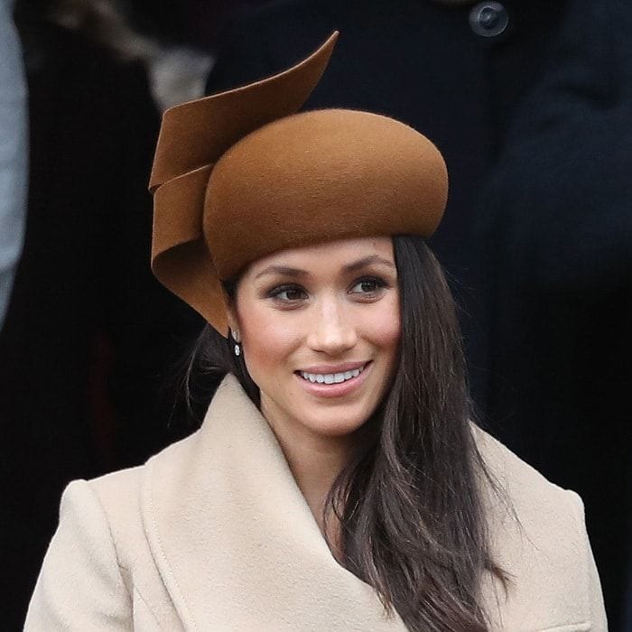 For her first Christmas with the Queen at Sandringham in 2017, Meghan chose an architectural chocolate brown hat by royal favourite Philip Treacy. Accompanied by Prince Harry at the St Mary Magdalene church service, the former actress was also joining Prince William and Kate Middleton for the first time at a royal engagement.
Photo: Chris Jackson/Getty Images