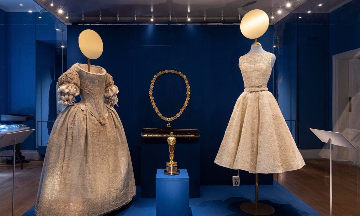 The Pigott Gallery features a 1660s silver tissue gown worn by Lady Theophilia Harris next to a dress designed by Edith Head for the film Roman Holiday, which was altered by Givenchy for the 1954 Oscars and worn by Audrey Hepburn.