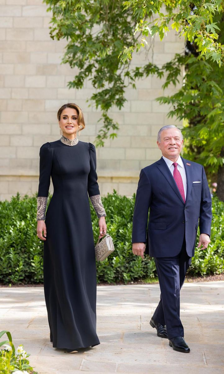 The mother of the groom, Queen Rania, looked elegant in a black Dior Couture gown, according to Harper's Bazaar Arabia.