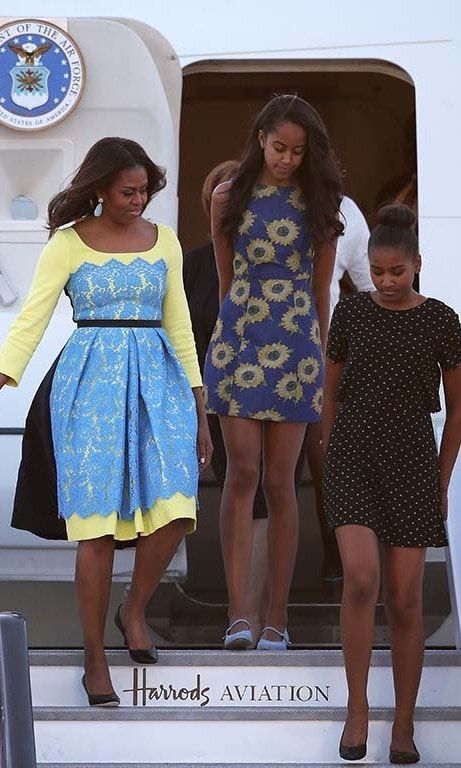 June 2015: Sasha and Malia (and their stylish mother) made a cool landing in sundresses during their trip to London.
<br>
Photo: Getty Images