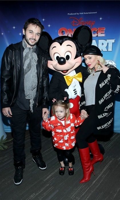 Christina Aguilera brought some Disney magic to her weekend when her and her partner Matthew Rutler took their daughter Summer Rain Rutler, 3, to <i>Disney On Ice: Follow Your Heart</i>. The trio joined Mickey Mouse himself for a photo while at the Staples Center event on December 16 in L.A.
Photo: Randy Shropshire/Getty Images for Feld Entertainment