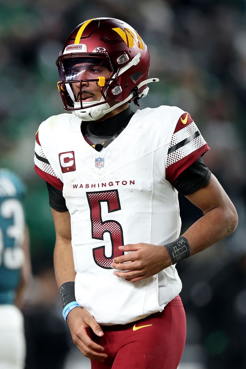 PHILADELPHIA, PENNSYLVANIA - JANUARY 26: Jayden Daniels #5 of the Washington Commanders runs off the field after being sacked on a fourth down while playing the Philadelphia Eagles during the fourth quarter in the NFC Championship Game at Lincoln Financial Field on January 26, 2025 in Philadelphia, Pennsylvania.  (Photo by Emilee Chinn/Getty Images)