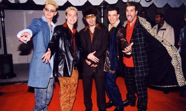 *NSync and in style! Justin (his frosted tips) and his former bandmates Lance Bass, Chris Kirkpatrick, JC Chasez and Joey Fatone rocked funky suits during the Billboard Music Awards in December 1998 in L.A.
<br>
Photo: Getty Images