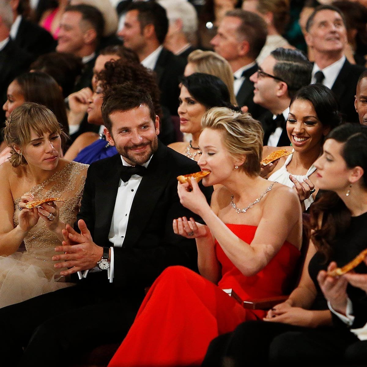 Jennifer Lawrence eating pizza at the Oscars.