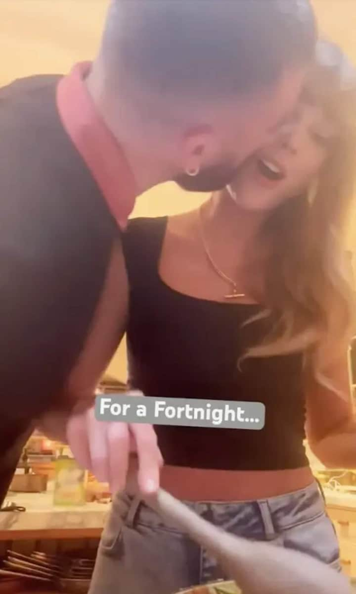 Travis Kelce kisses Swift while she makes her famous pastry