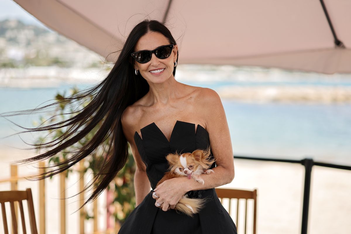 Demi Moore and her dog Pilaf attend a talk at the 77th annual Cannes Film Festival 