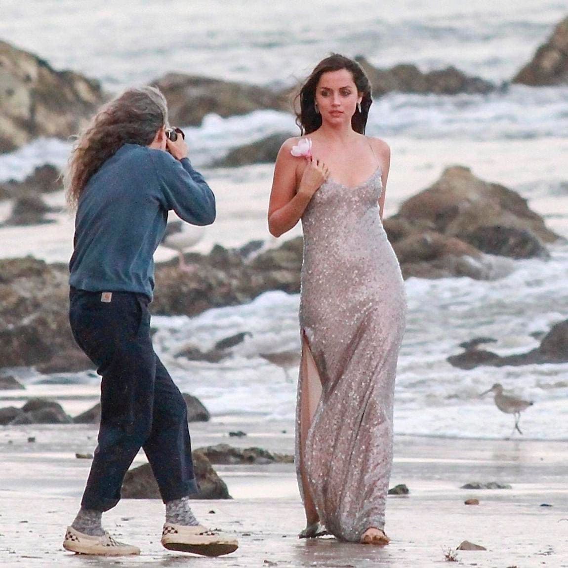 Ana de Armas poses at the beach for a perfume commercial in Malibu.