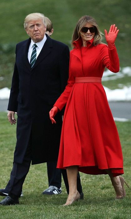 The first lady in red! Melania wowed wearing a custom coatdress by New Yorkbased designer Alice Roi for her journey from the White House to Mar-a-Lago in Palm Beach, Florida.
Photo: Chip Somodevilla/Getty Images