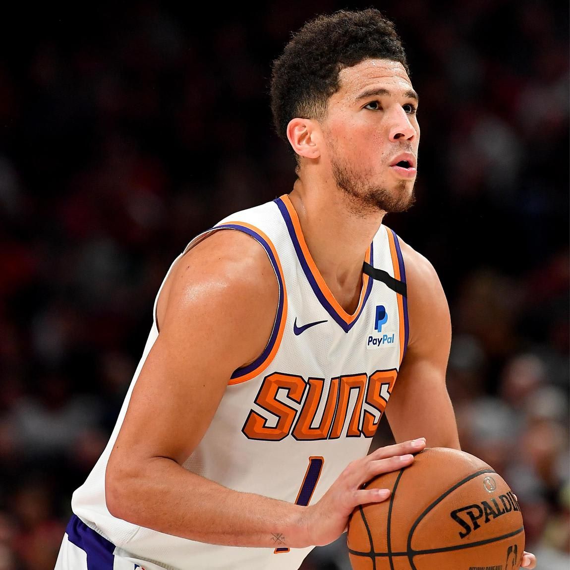 Devin Booker #1 of the Phoenix Suns shoots a free throw