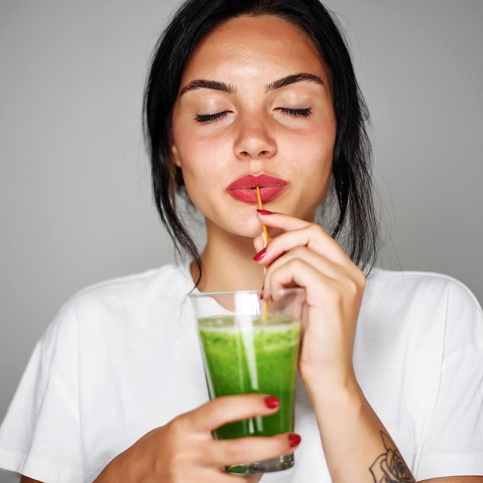 girl drinking detox juice