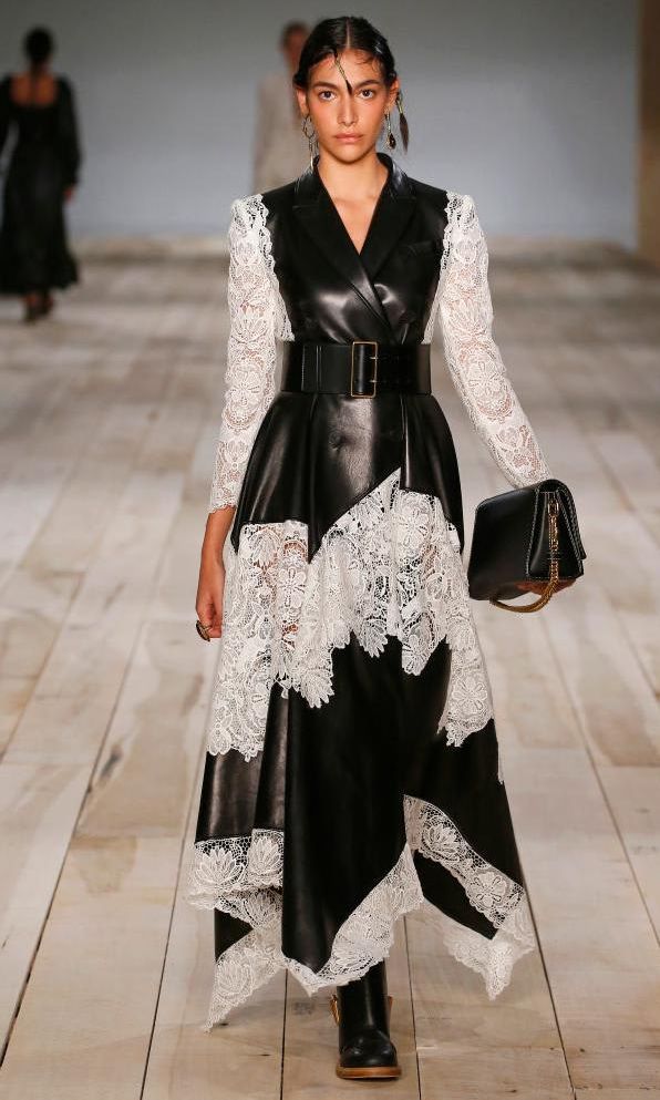 Maxi clutch and leather and lace dress by Alexander McQueen