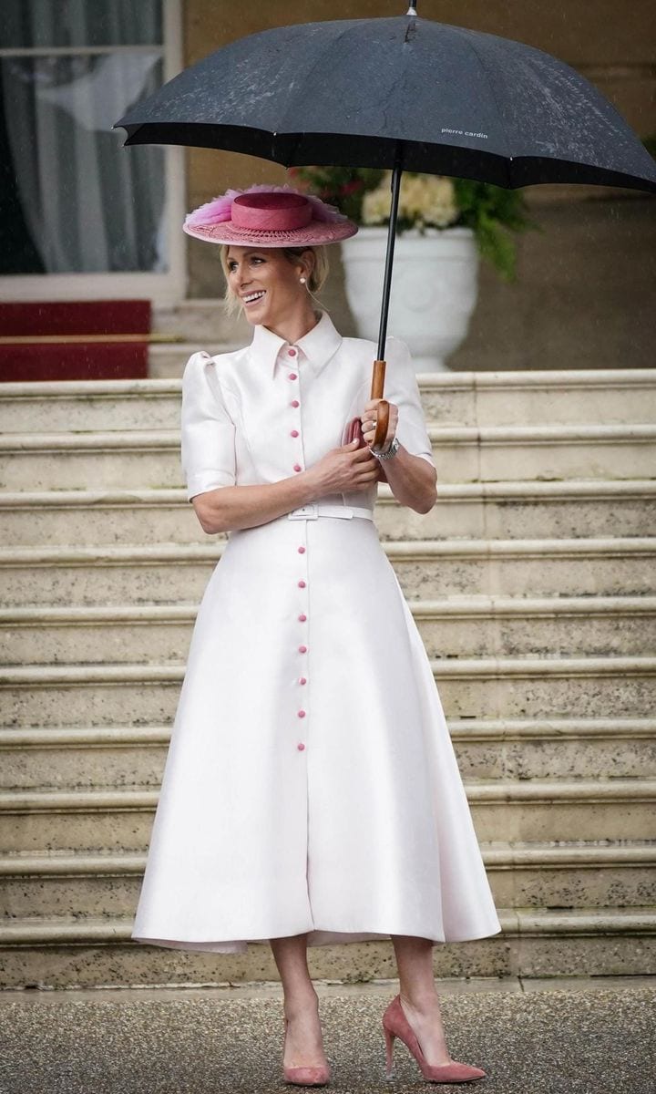 Peter's sister Zara Tindall exuded elegance in a Laura Green dress (via Royal Fashion Police) teamed with a pink boater hat and suede pumps.
